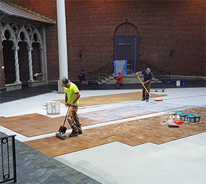 The new cork flooring being installed in the Shaw Gothic Cloister.