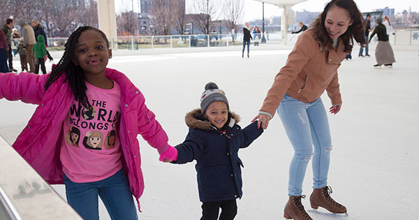 Diverse family on the ice